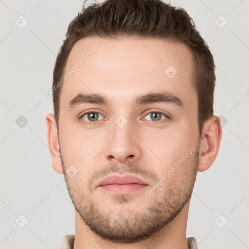 Neutral white young-adult male with short  brown hair and grey eyes