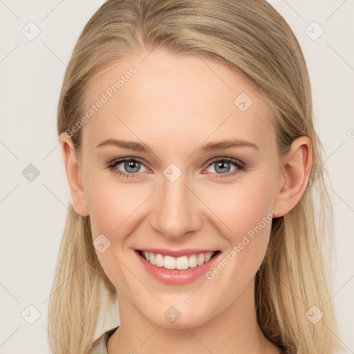 Joyful white young-adult female with long  brown hair and blue eyes