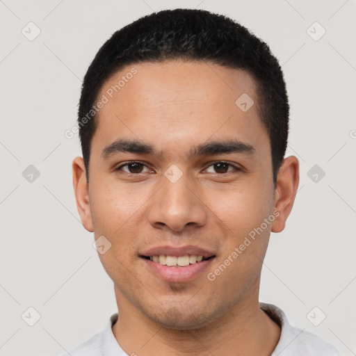 Joyful white young-adult male with short  black hair and brown eyes