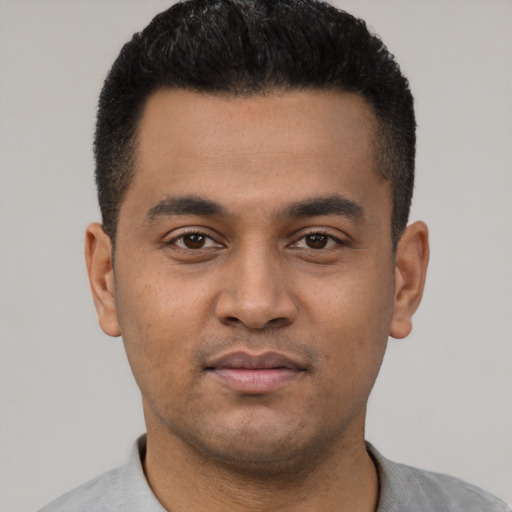 Neutral latino young-adult male with short  black hair and brown eyes