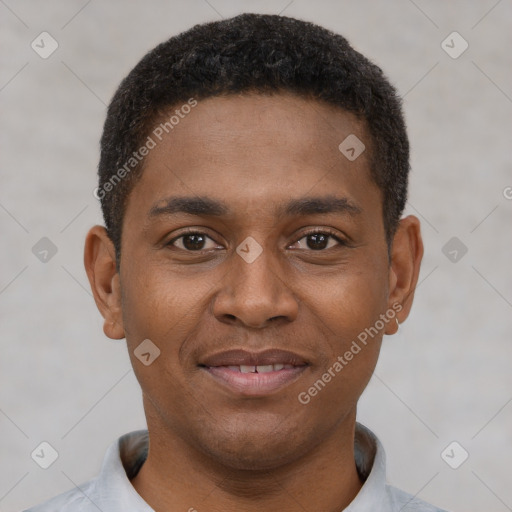 Joyful black young-adult male with short  black hair and brown eyes