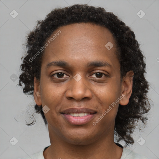 Joyful black young-adult male with short  brown hair and brown eyes