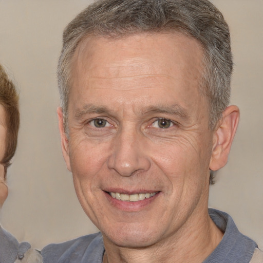 Joyful white middle-aged male with short  brown hair and brown eyes