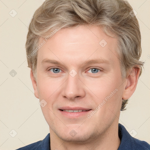 Joyful white adult male with short  brown hair and grey eyes