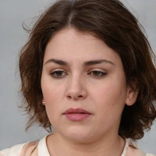 Neutral white young-adult female with medium  brown hair and brown eyes