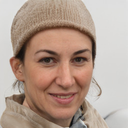 Joyful white adult female with short  brown hair and grey eyes