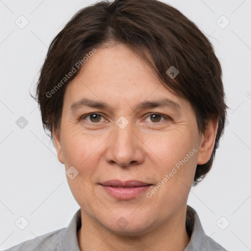 Joyful white adult female with short  brown hair and brown eyes