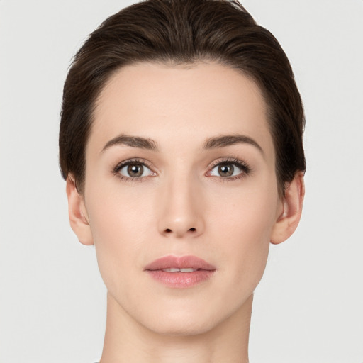 Neutral white young-adult female with short  brown hair and brown eyes