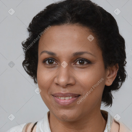 Joyful black adult female with medium  brown hair and brown eyes