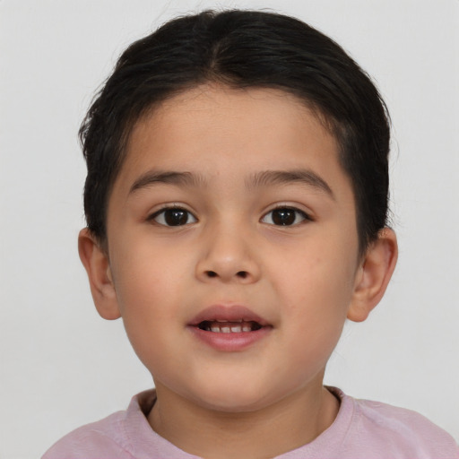 Joyful white child female with short  brown hair and brown eyes