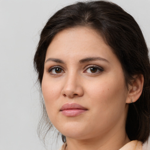 Joyful white young-adult female with medium  brown hair and brown eyes