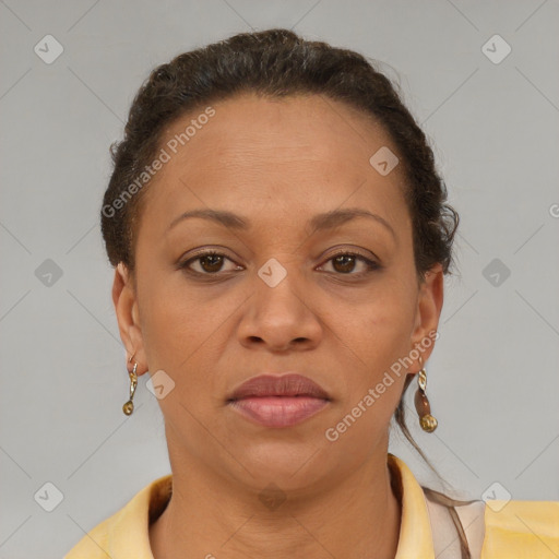 Joyful black adult female with short  brown hair and brown eyes