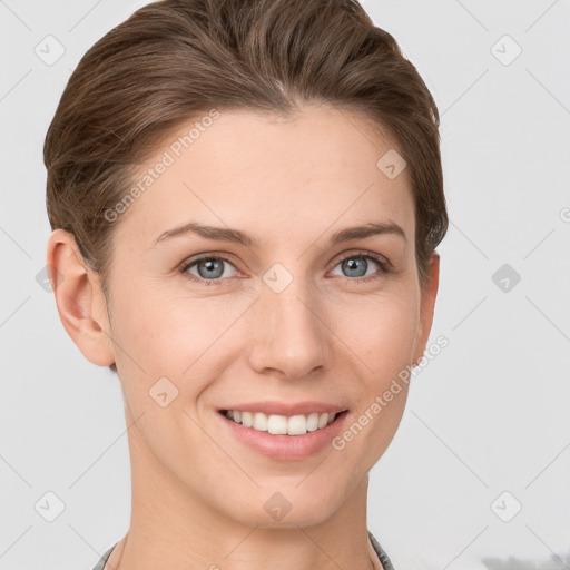 Joyful white young-adult female with short  brown hair and grey eyes