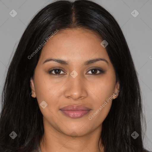 Joyful black young-adult female with long  brown hair and brown eyes