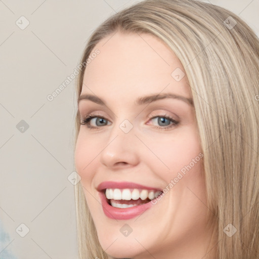 Joyful white young-adult female with long  brown hair and blue eyes