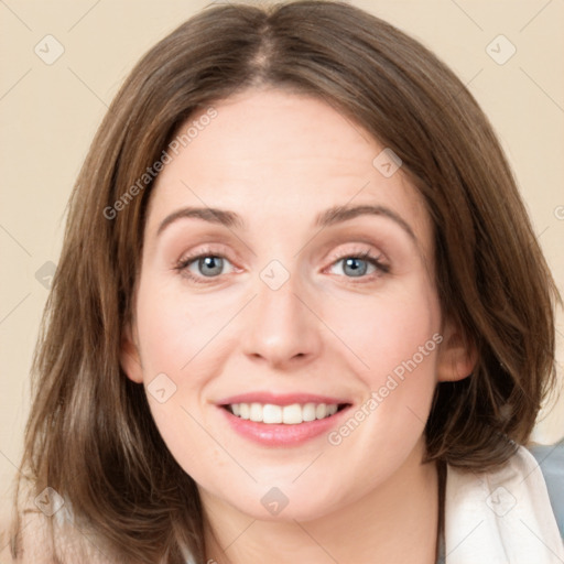 Joyful white young-adult female with medium  brown hair and green eyes