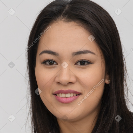 Joyful asian young-adult female with long  brown hair and brown eyes