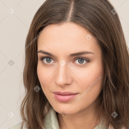 Neutral white young-adult female with long  brown hair and brown eyes