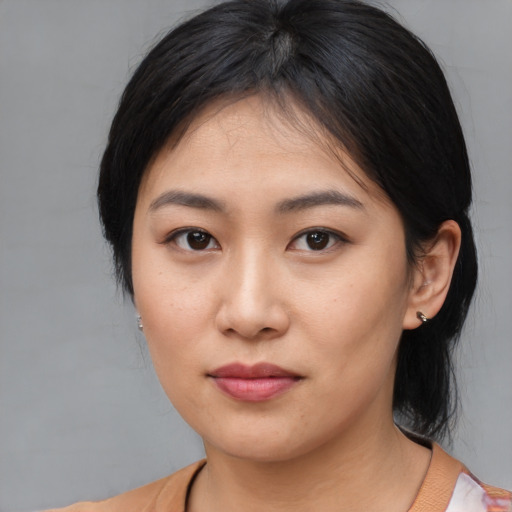 Neutral asian young-adult female with medium  brown hair and brown eyes