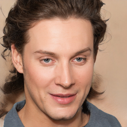 Joyful white young-adult male with medium  brown hair and brown eyes