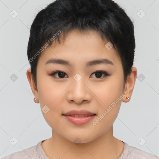 Joyful asian child female with short  brown hair and brown eyes