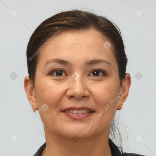 Joyful white adult female with short  brown hair and brown eyes