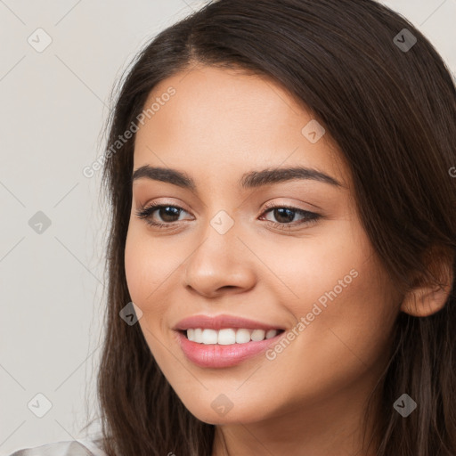 Joyful white young-adult female with long  brown hair and brown eyes