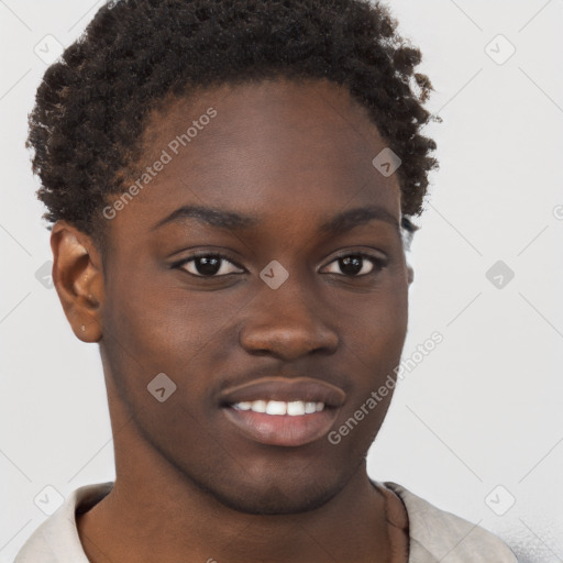 Joyful black young-adult male with short  brown hair and brown eyes