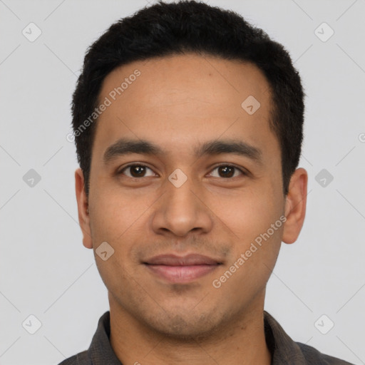 Joyful latino young-adult male with short  black hair and brown eyes