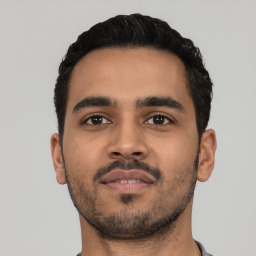 Neutral latino young-adult male with short  black hair and brown eyes