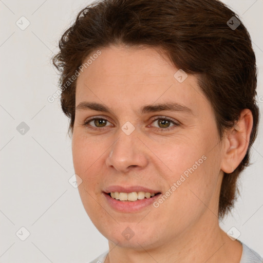 Joyful white young-adult female with short  brown hair and brown eyes