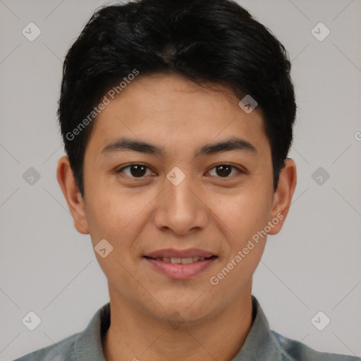 Joyful asian young-adult male with short  black hair and brown eyes