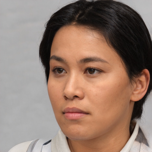 Neutral asian young-adult female with medium  brown hair and brown eyes