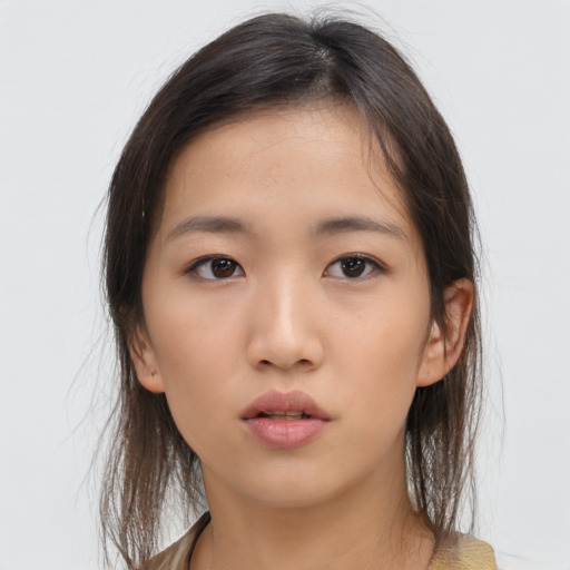 Neutral asian young-adult female with medium  brown hair and brown eyes