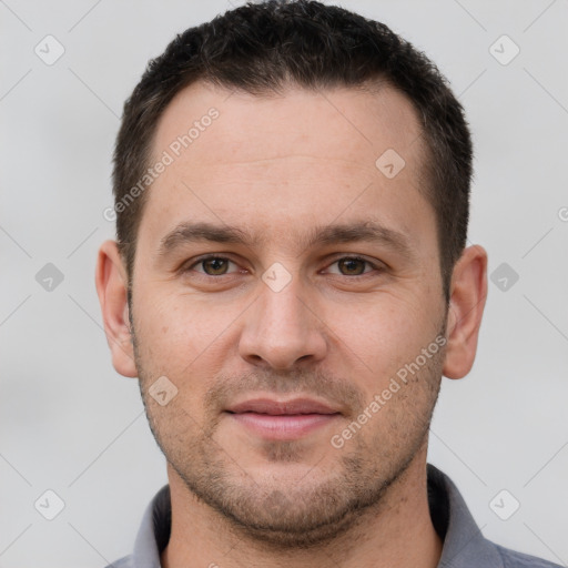 Joyful white young-adult male with short  brown hair and brown eyes