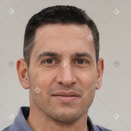 Joyful white adult male with short  brown hair and brown eyes