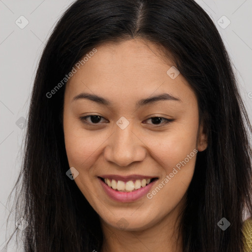 Joyful asian young-adult female with long  brown hair and brown eyes