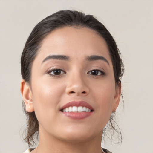 Joyful white young-adult female with medium  brown hair and brown eyes