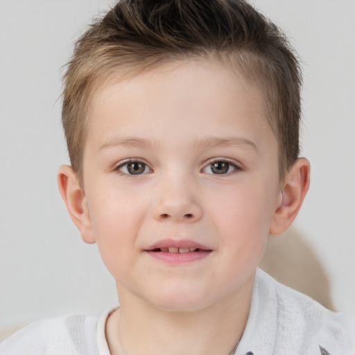 Joyful white child male with short  brown hair and brown eyes