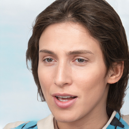 Joyful white young-adult female with medium  brown hair and grey eyes