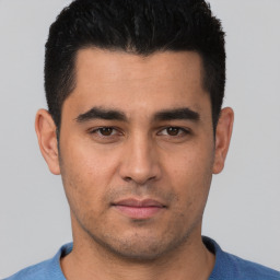 Neutral white young-adult male with short  black hair and brown eyes