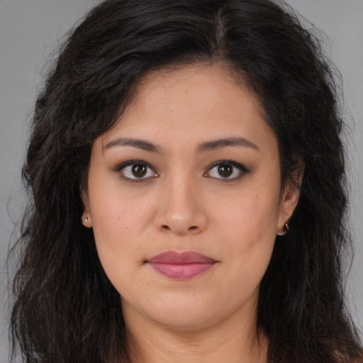 Joyful asian young-adult female with long  brown hair and brown eyes