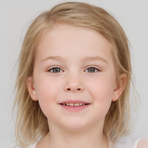 Joyful white child female with medium  brown hair and blue eyes