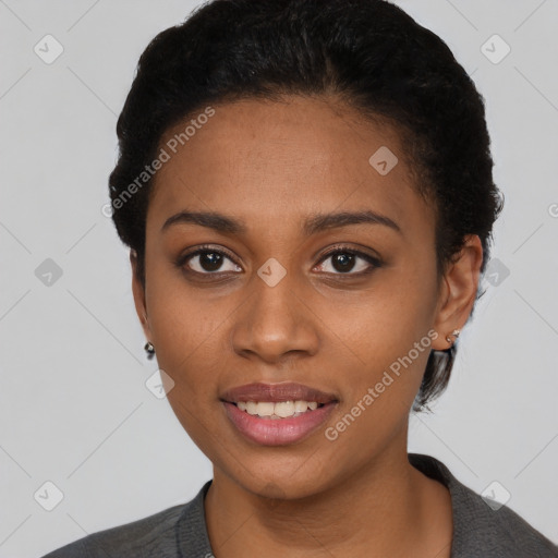 Joyful black young-adult female with short  black hair and brown eyes