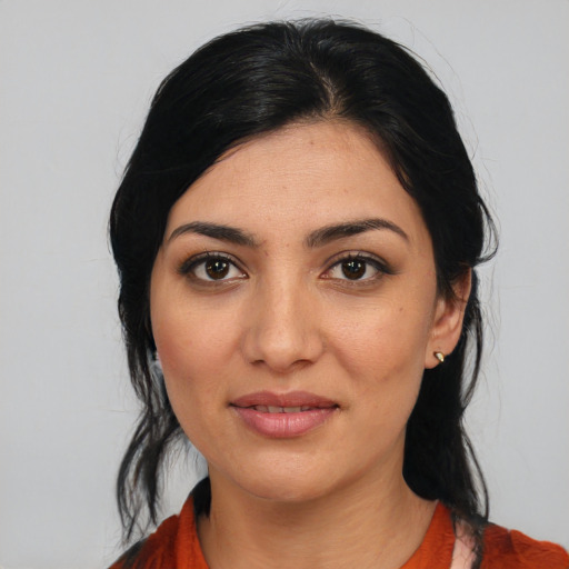 Joyful white young-adult female with medium  black hair and brown eyes