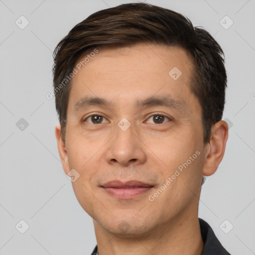 Joyful white adult male with short  brown hair and brown eyes