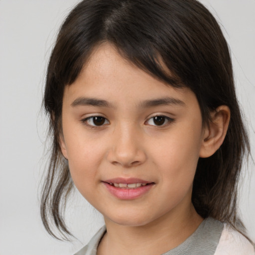 Joyful white child female with medium  brown hair and brown eyes