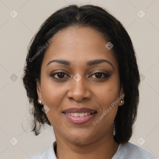 Joyful black young-adult female with medium  brown hair and brown eyes