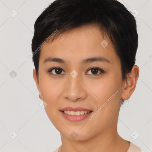 Joyful asian young-adult female with short  brown hair and brown eyes