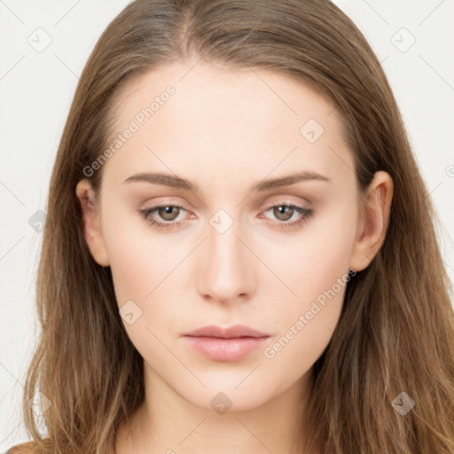 Neutral white young-adult female with long  brown hair and brown eyes